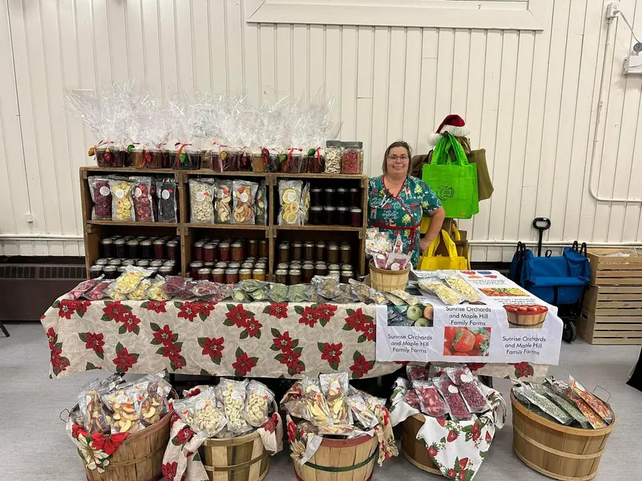 The Sunrise Orchards market table stocked with jams and freeze-dried fruit